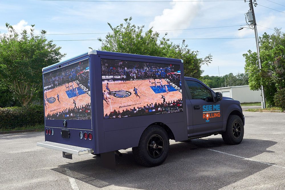 mobile LED truck displaying full-court basketball game
